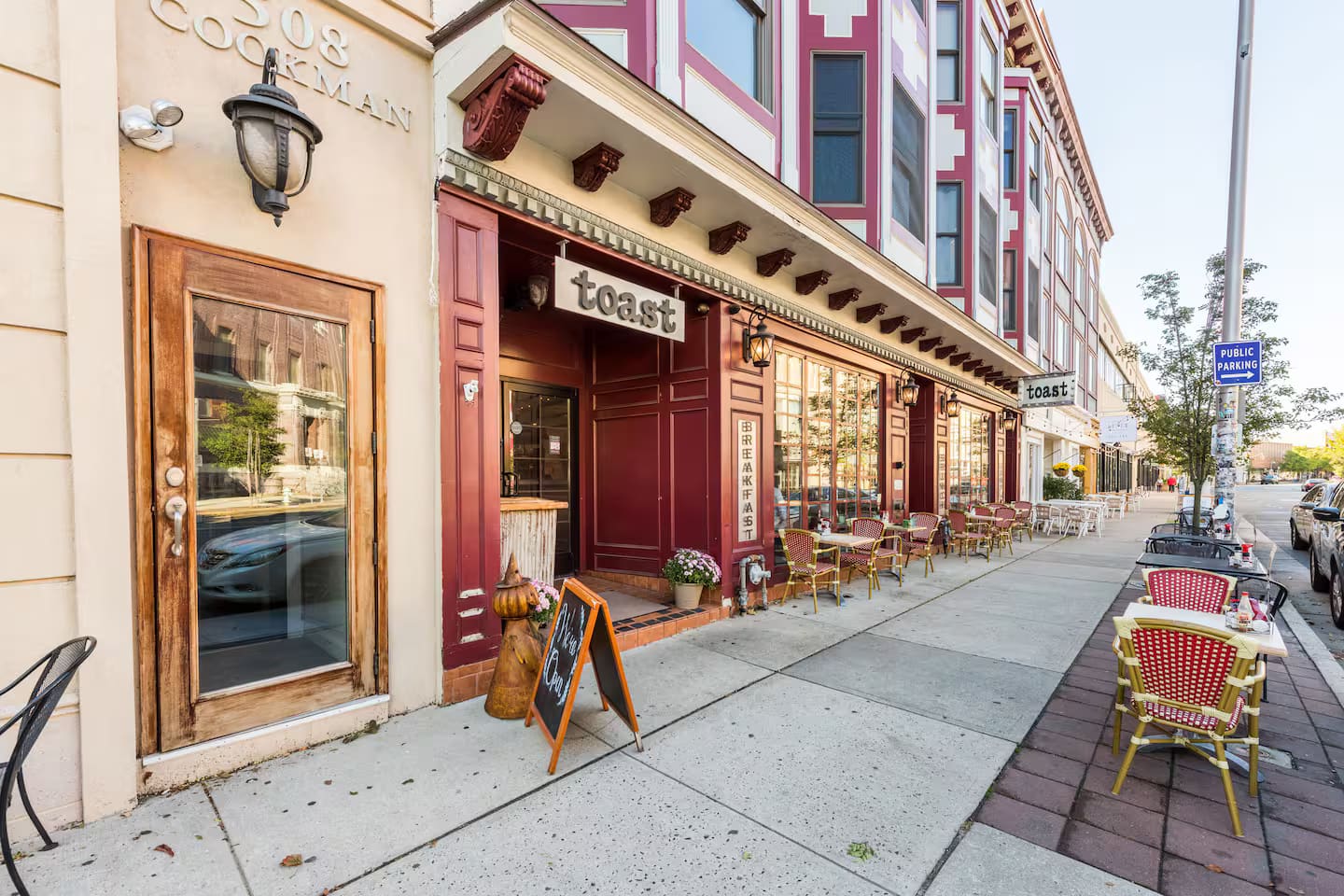Open-plan living room with vaulted ceilings and exposed brick